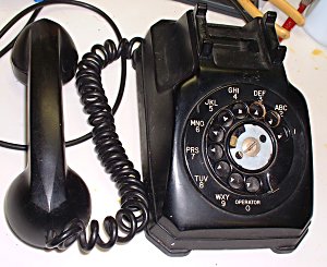 Stromberg-Carlson black 1962 cut-corner desk set with the handset off